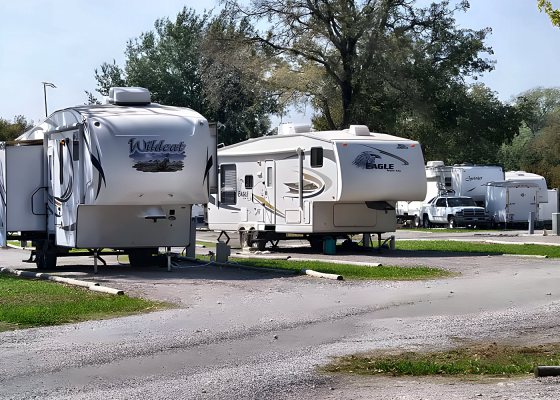 Fifth-wheel trailers lined up along the park road