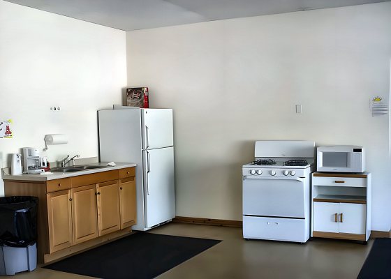 Clubhouse kitchen with refrigerator, stove and microwave