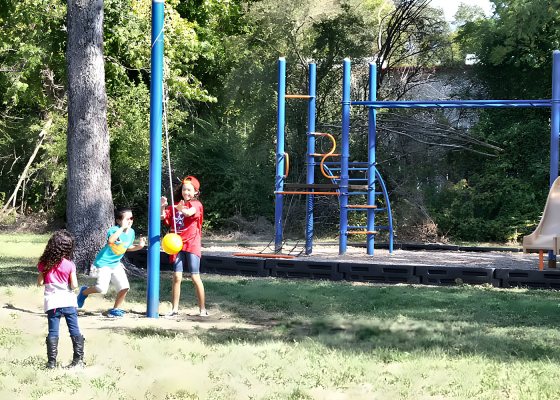 Children playing on the playground at Lazy L RV Park